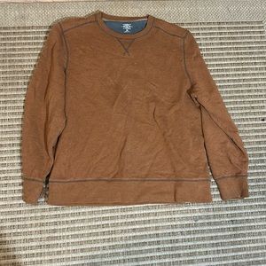 A women’s light brown sweater, extra large